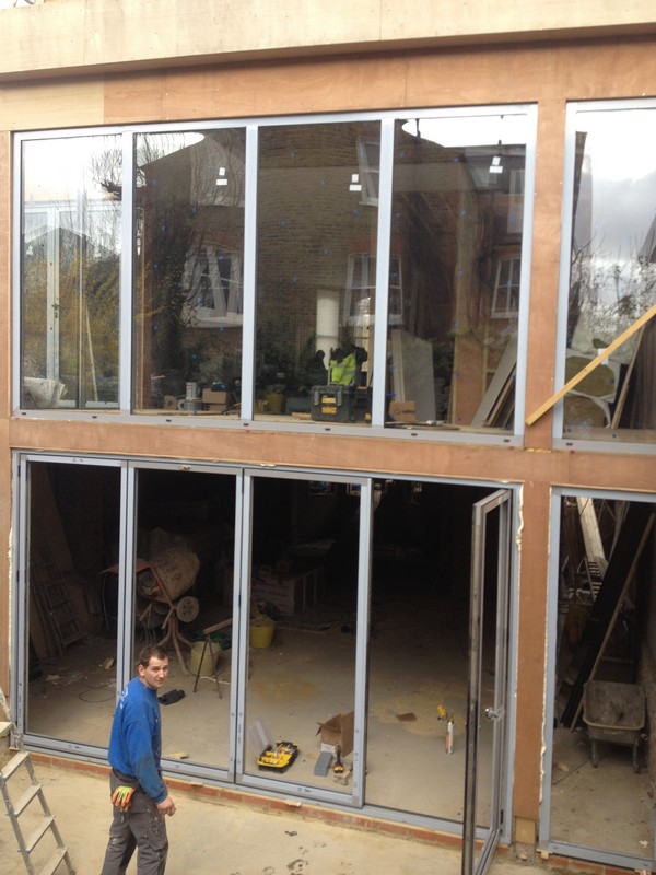 Aluminium bi-fold doors with two-storey glazing in Islington