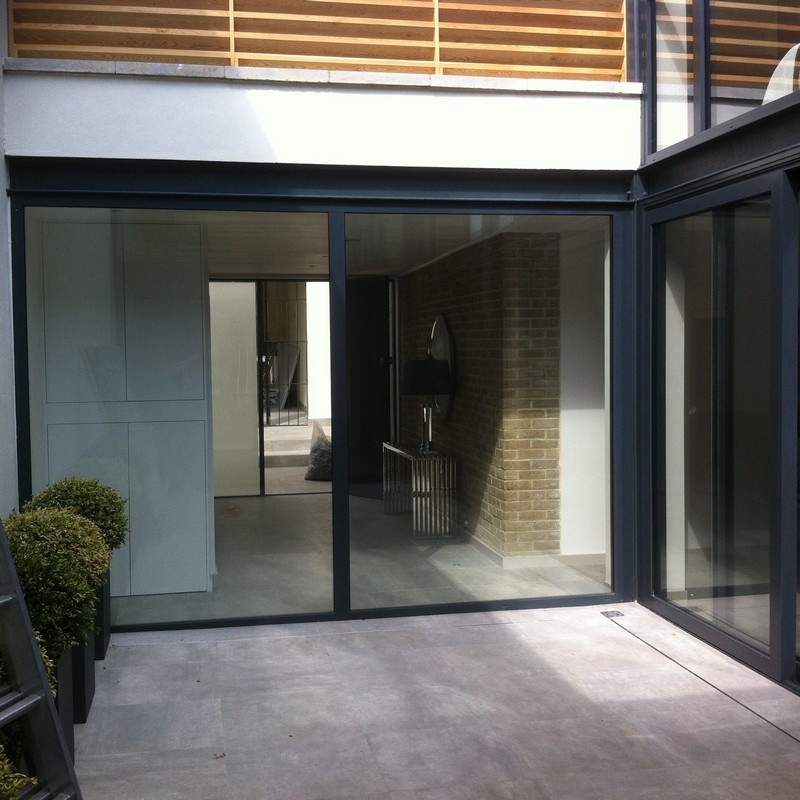 Floor-to-ceiling sliding doors opening to courtyard in Islington