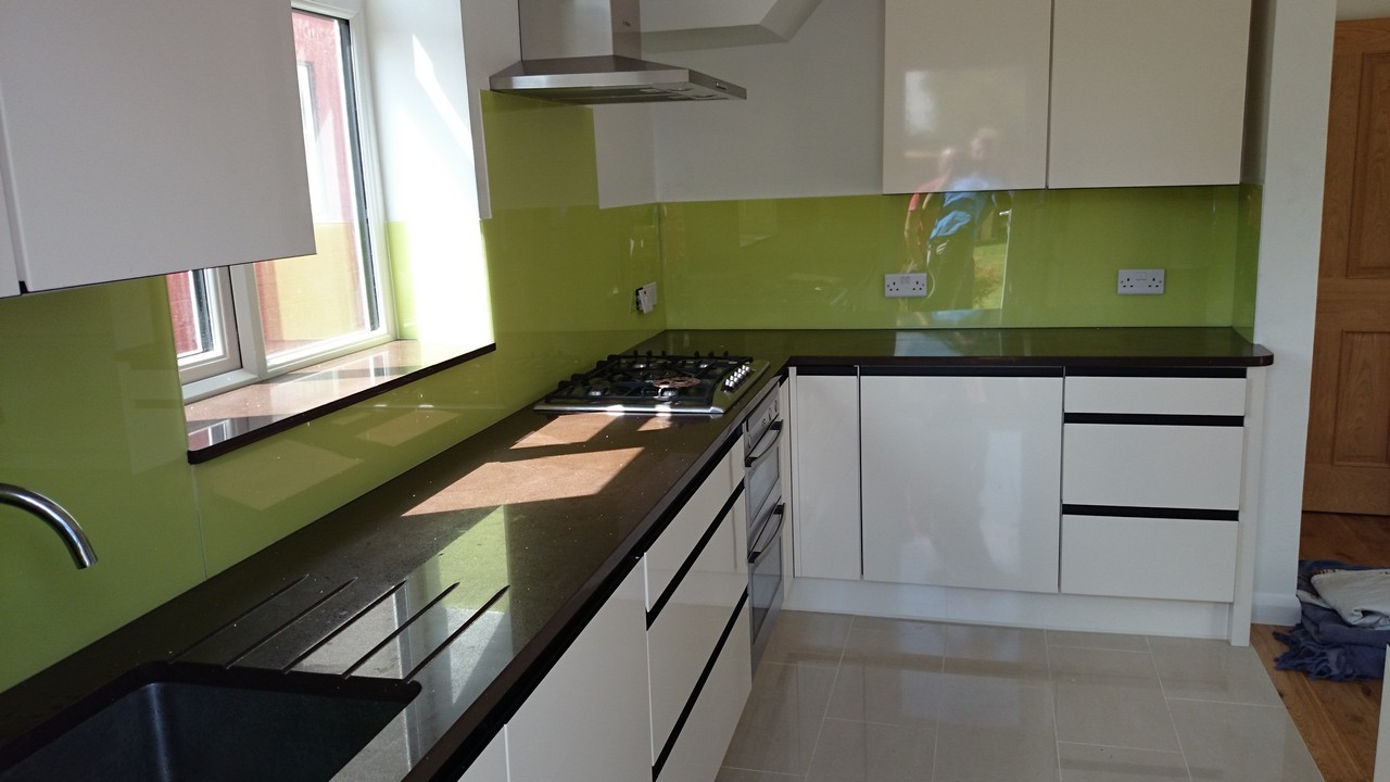 Lime green glass kitchen splashback installed by Islington glaziers
